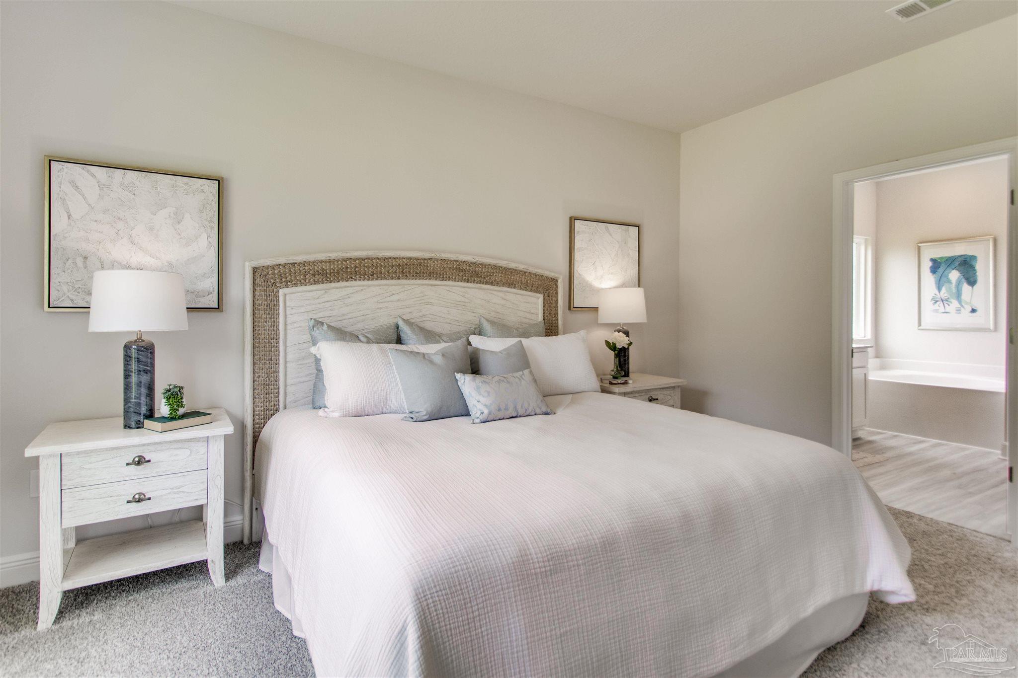 4745 Redhead Court Pace, FL 32571 - Photo 26 of 44 a bedroom with a bed and a night stand