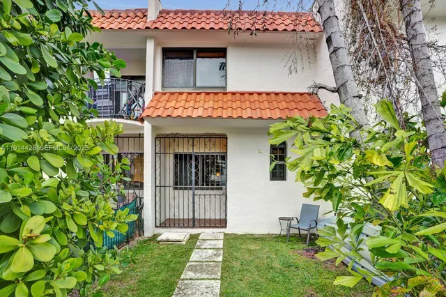 a front view of a house with yard