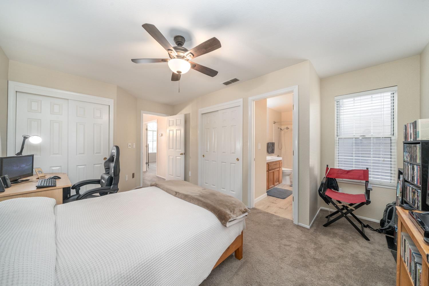 4112 Alex Lane Carmichael, CA 95608 - Photo 27 of 36 a bedroom with a bed a desk and chair
