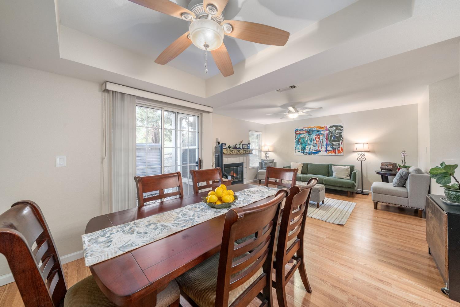 4112 Alex Lane Carmichael, CA 95608 - Photo 7 of 36 a dining room with furniture a window and wooden floor