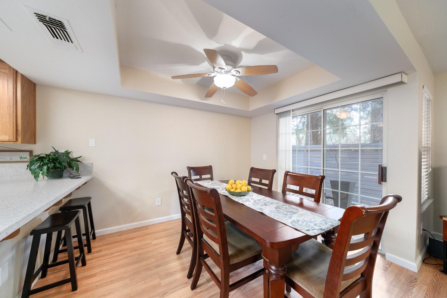 4112 Alex Lane Carmichael, CA 95608 - Photo 10 of 36 a view of a dining room with furniture window and wooden floor