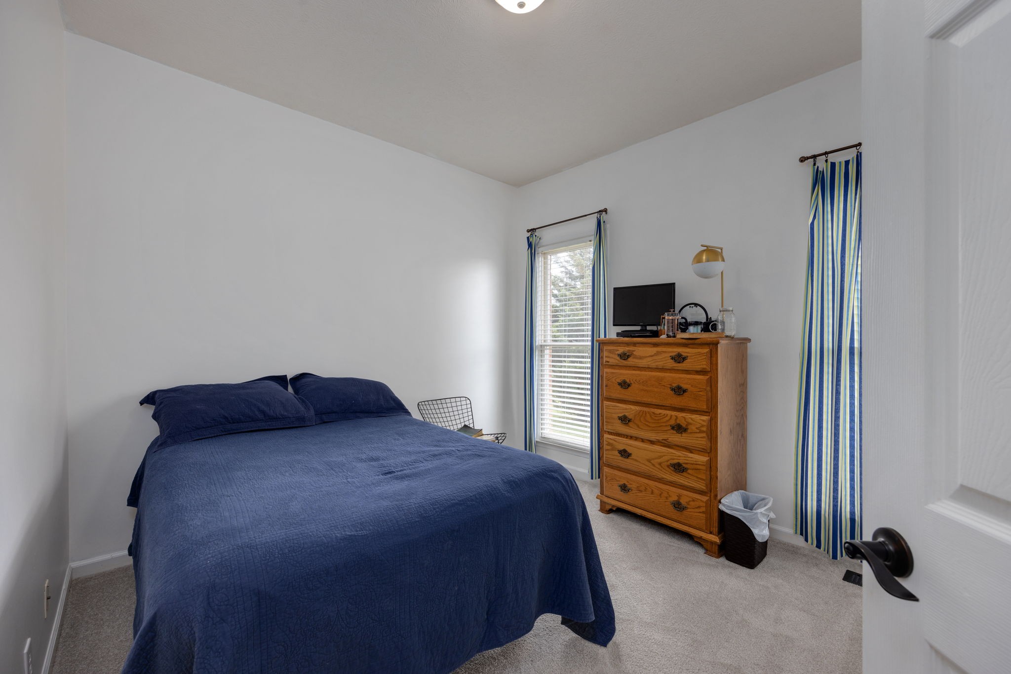 298 Corinth Road Portland, TN 37148 - Photo 21 of 49 a bedroom with a bed and a dresser