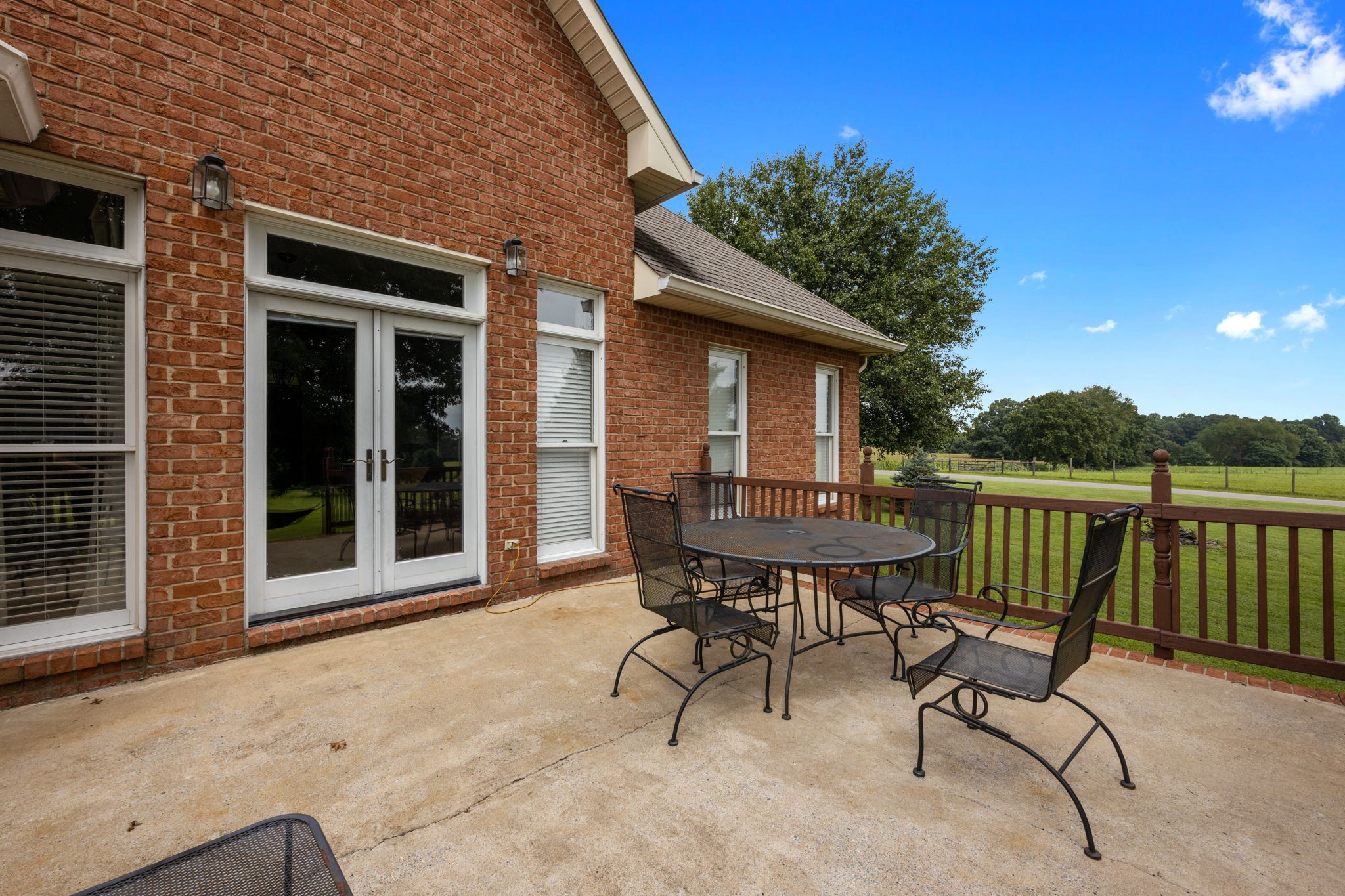 298 Corinth Road Portland, TN 37148 - Photo 38 of 49 a view of a patio with a table and chairs