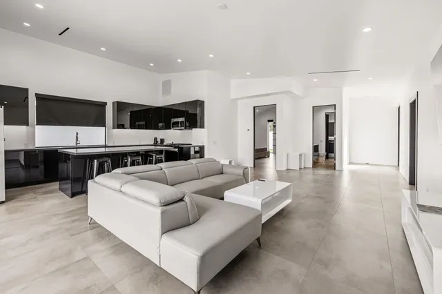 a kitchen with stainless steel appliances stove microwave and cabinets