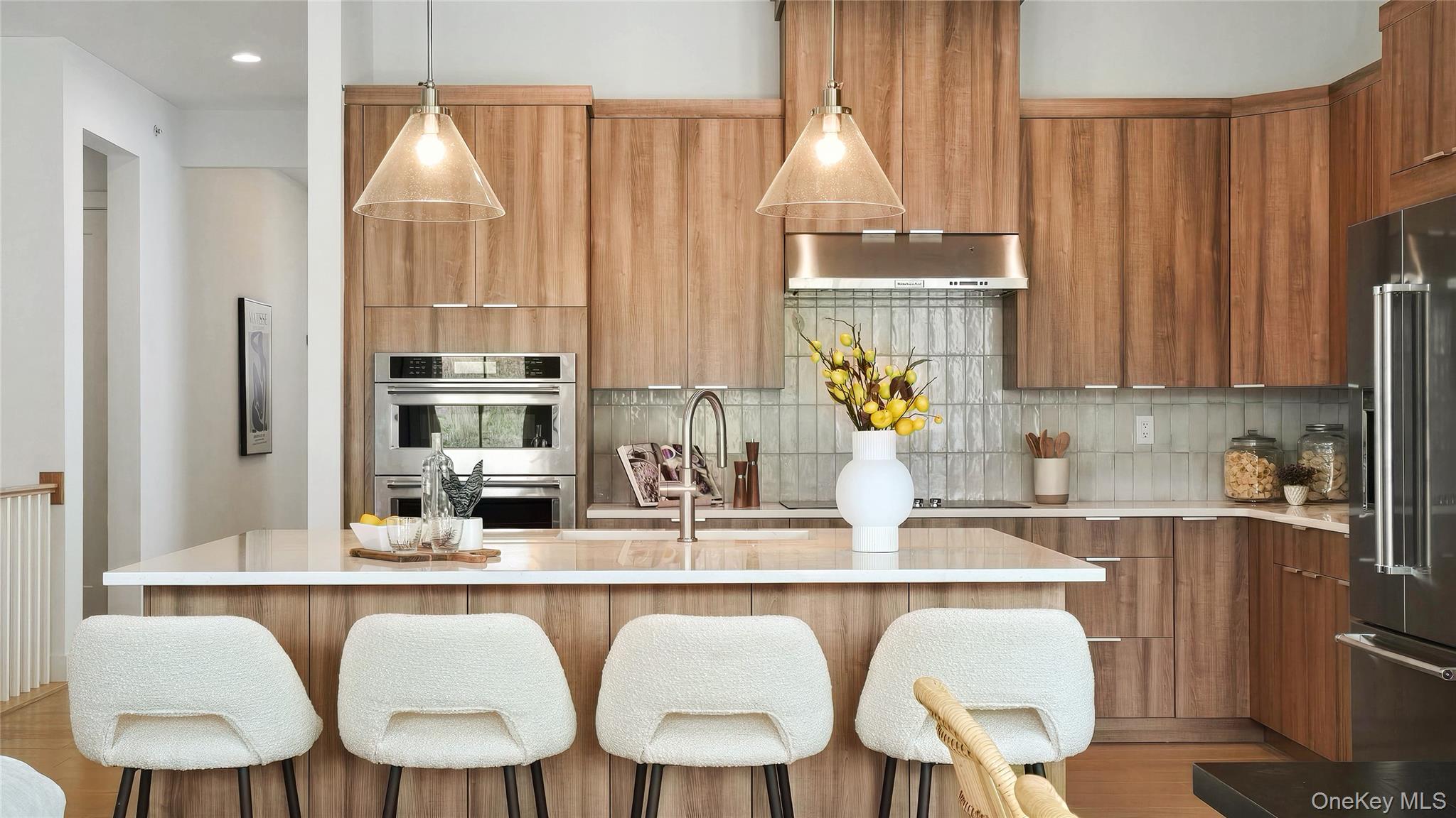 a kitchen with a table chairs sink and cabinets