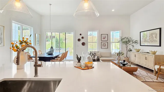 a very nice looking living room with furniture and a large window