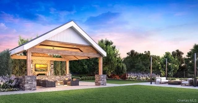 a swimming pool with outdoor seating and yard