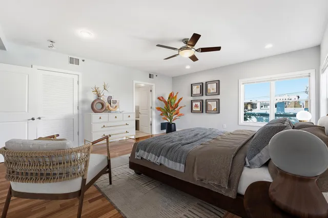 a living room with a bed and furniture