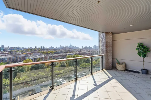 a view of a balcony with furniture