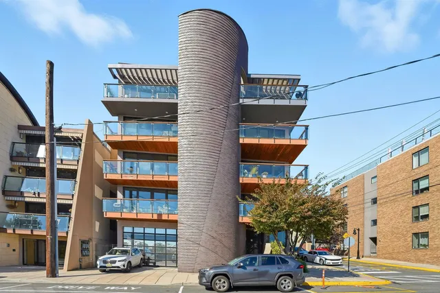 a front view of a building with parking space