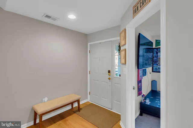 a room with a couch and a walk in closet