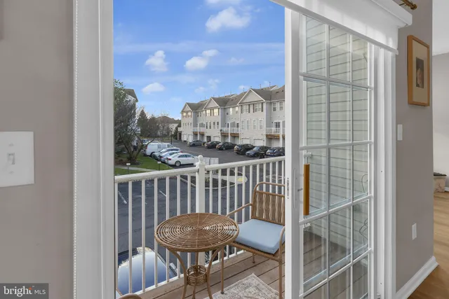 a view of a balcony with chair and glass door