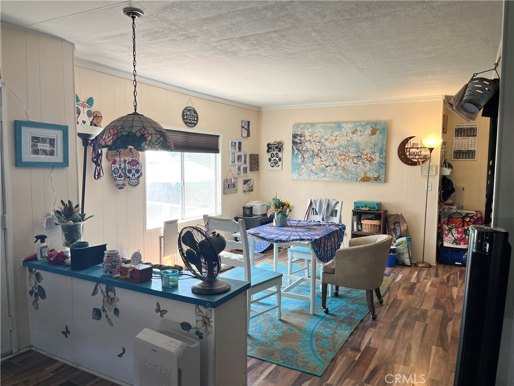 4041 Pedley Road, Unit 93 Riverside, CA 92509 - Photo 11 of 27 a living room with furniture and a window