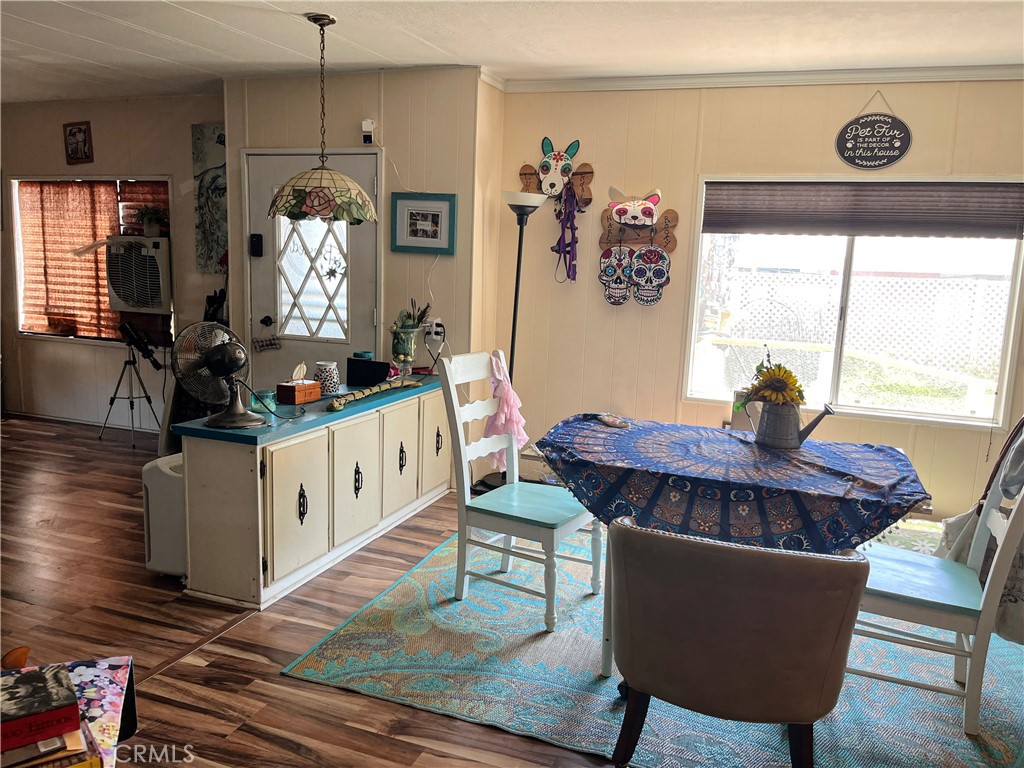 4041 Pedley Road, Unit 93 Riverside, CA 92509 - Photo 13 of 27 a living room with furniture a chandelier and a window