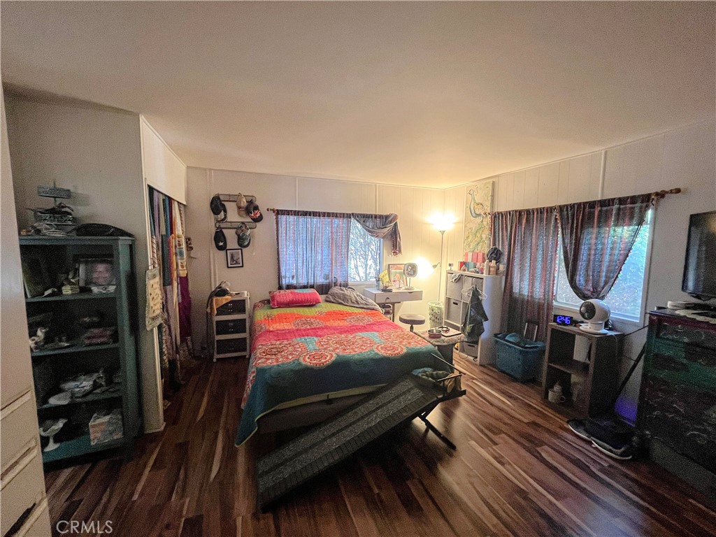 4041 Pedley Road, Unit 93 Riverside, CA 92509 - Photo 14 of 27 a bed room with a bed and a closet