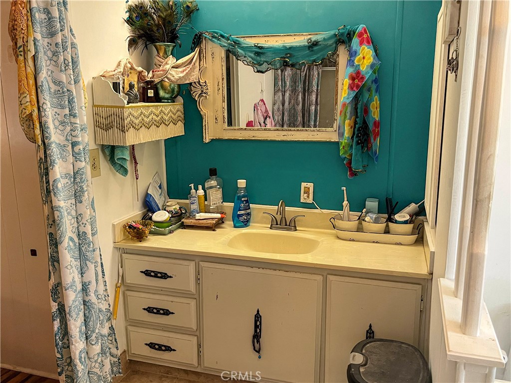 4041 Pedley Road, Unit 93 Riverside, CA 92509 - Photo 17 of 27 a bathroom with a sink and a mirror