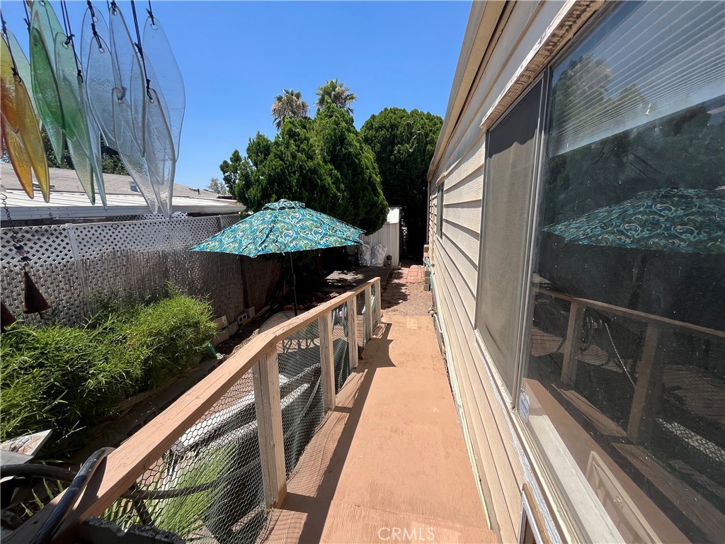 4041 Pedley Road, Unit 93 Riverside, CA 92509 - Photo 23 of 27 a view of balcony with wooden floor