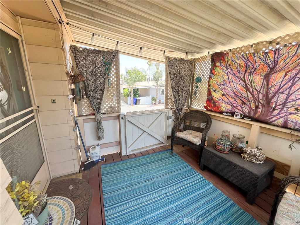 4041 Pedley Road, Unit 93 Riverside, CA 92509 - Photo 4 of 27 a living room with furniture windows and wooden floor