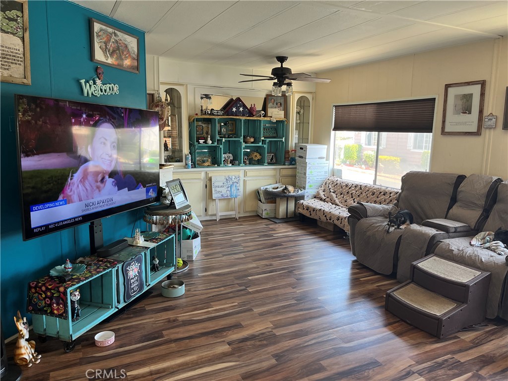 4041 Pedley Road, Unit 93 Riverside, CA 92509 - Photo 6 of 27 a living room with furniture and a flat screen tv