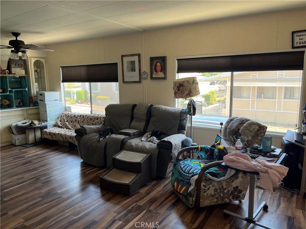 4041 Pedley Road, Unit 93 Riverside, CA 92509 - Photo 7 of 27 a living room with furniture and a large window