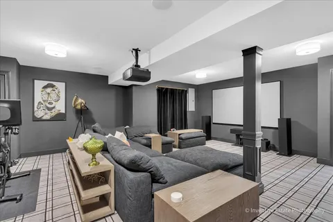 a living room with furniture and a chandelier