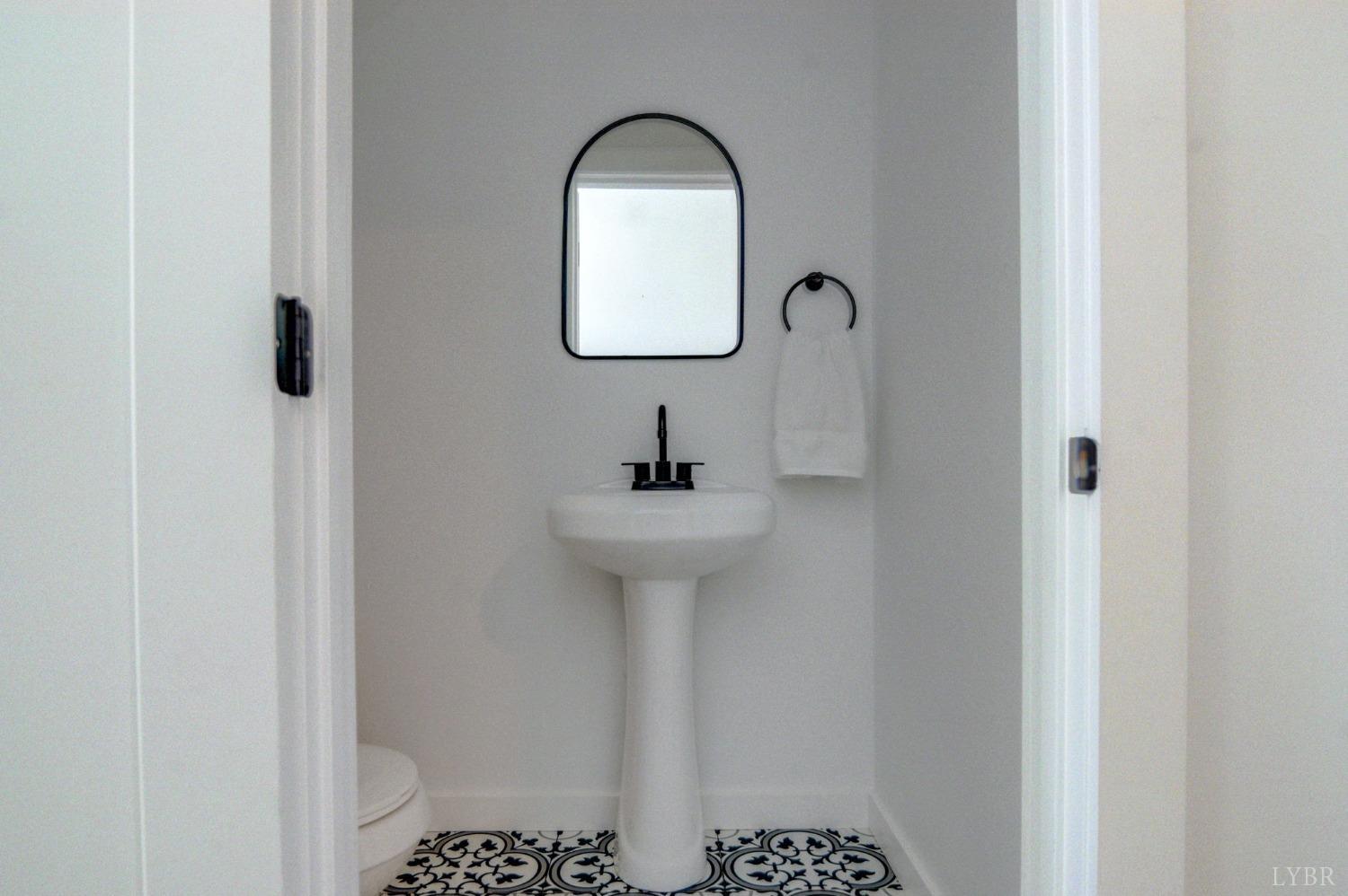1498 Browns Mill Road Rustburg, VA 24588 - Photo 17 of 54 a bathroom with a sink a light fixture and a mirror