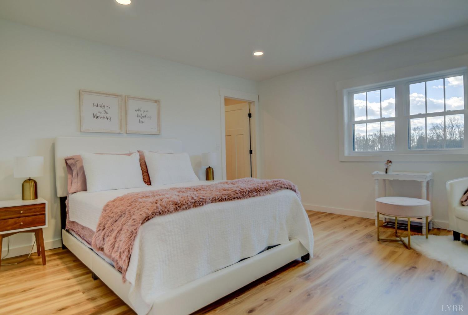 1498 Browns Mill Road Rustburg, VA 24588 - Photo 23 of 54 a bed room with a bed and a chair