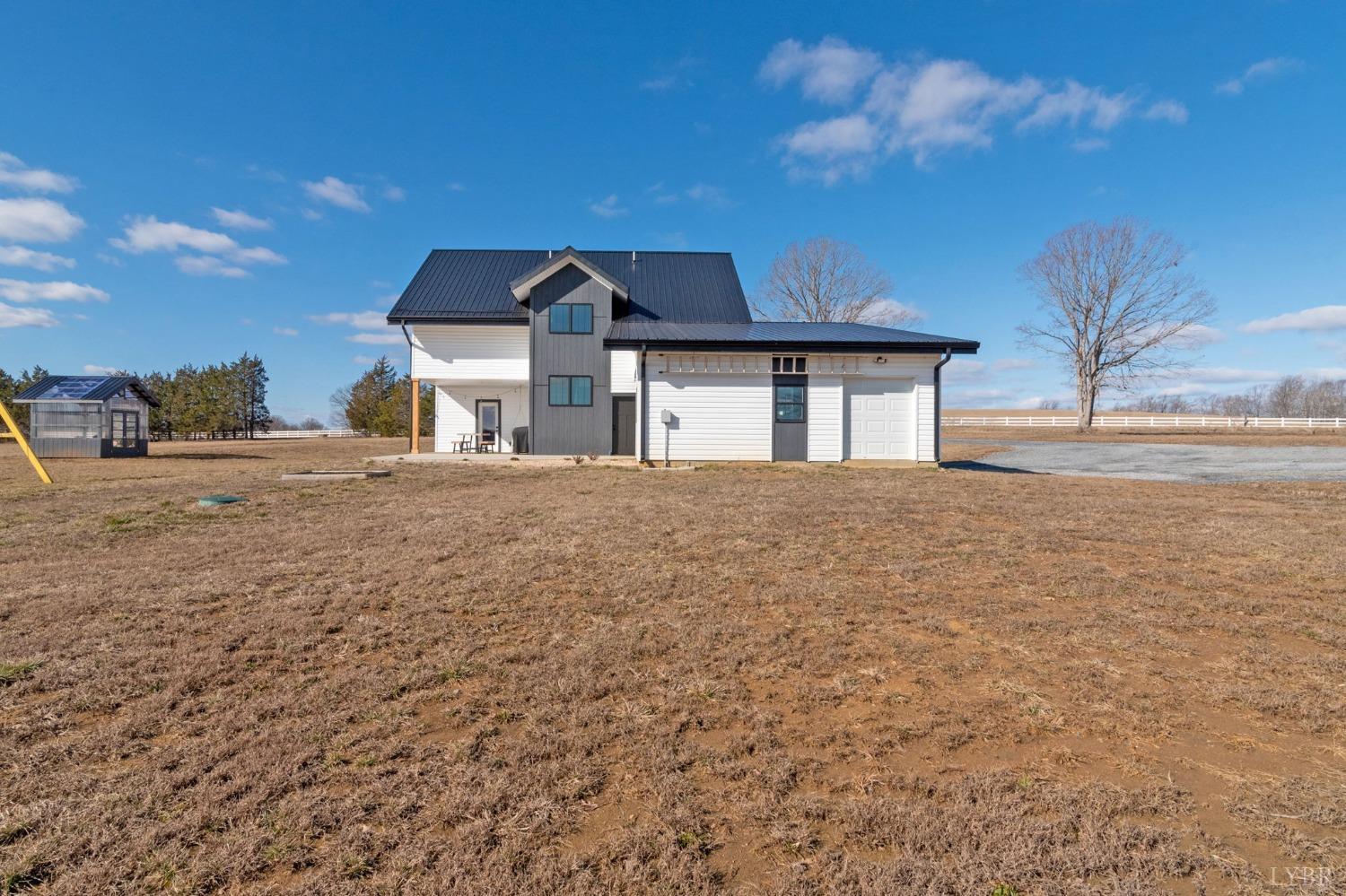 1498 Browns Mill Road Rustburg, VA 24588 - Photo 50 of 54 a front view of a house with a yard