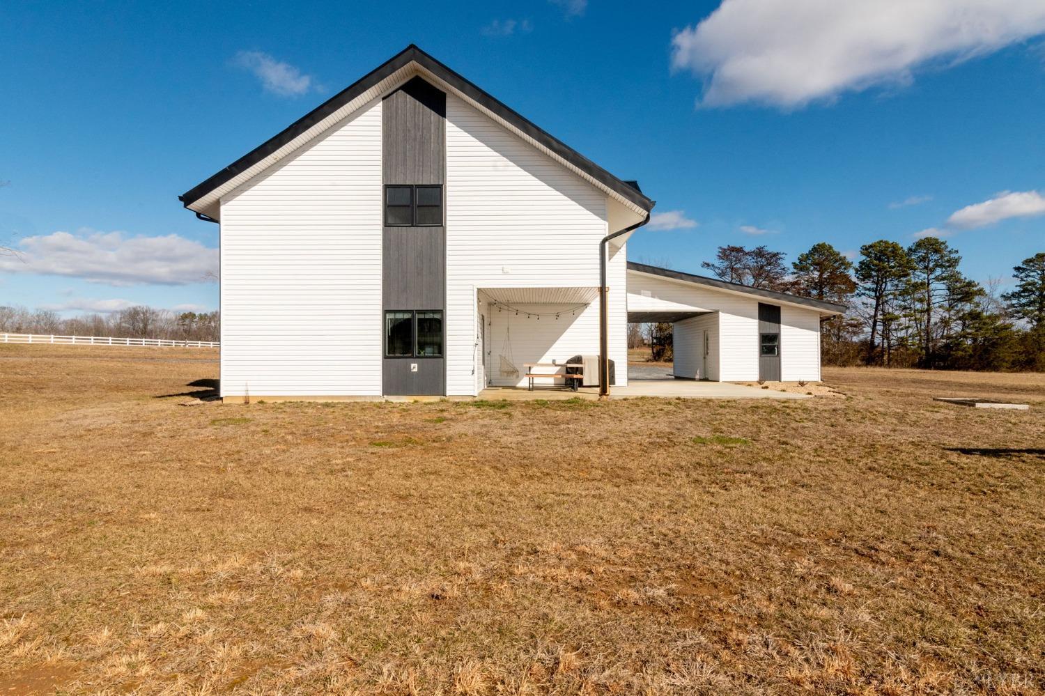 1498 Browns Mill Road Rustburg, VA 24588 - Photo 53 of 54 a view of a house with backyard and road
