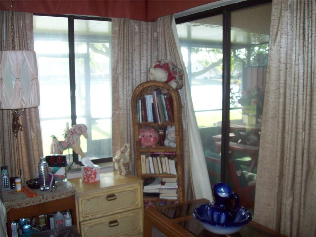 5255 Gate Lake Road, Unit 5255 Tamarac, FL 33319 - Photo 8 of 25 a view of living room with a large window and furniture