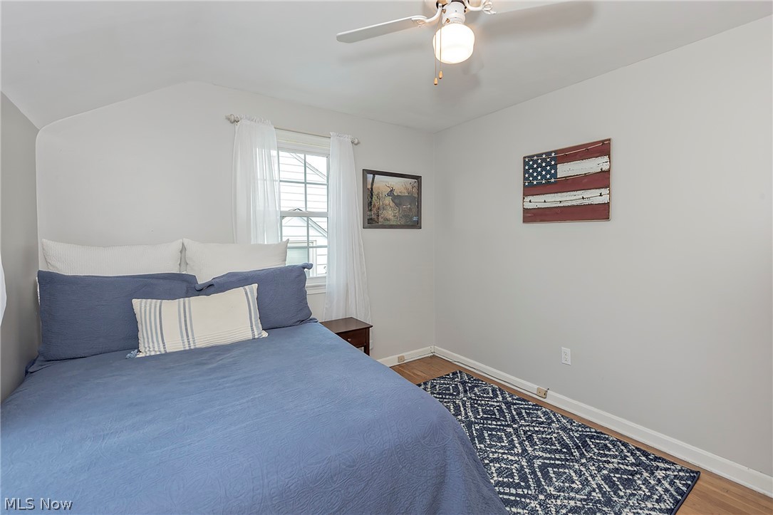 1604 Biltmore Road Cleveland, OH 44124 - Photo 21 of 40 Bedroom featuring ceiling fan, dark hardwood / wood-style flooring, and vaulted ceiling