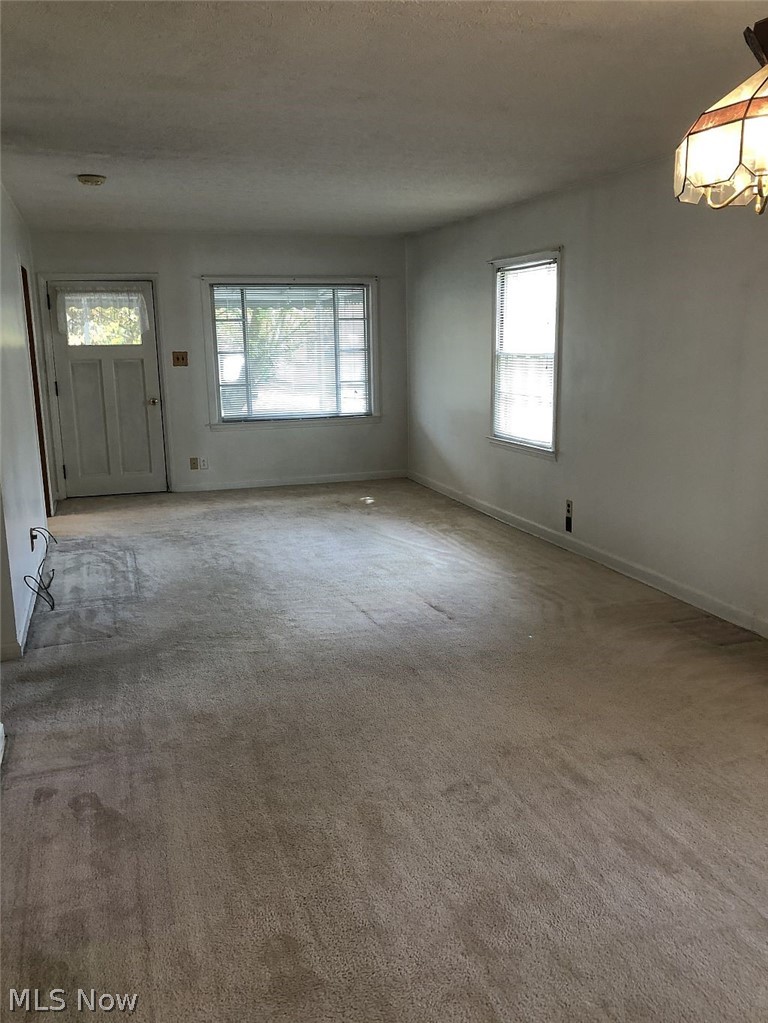821 Reed Avenue Akron, OH 44306 - Photo 6 of 21 Front great room entry opens into the sunroom porch and has lots of natural light.