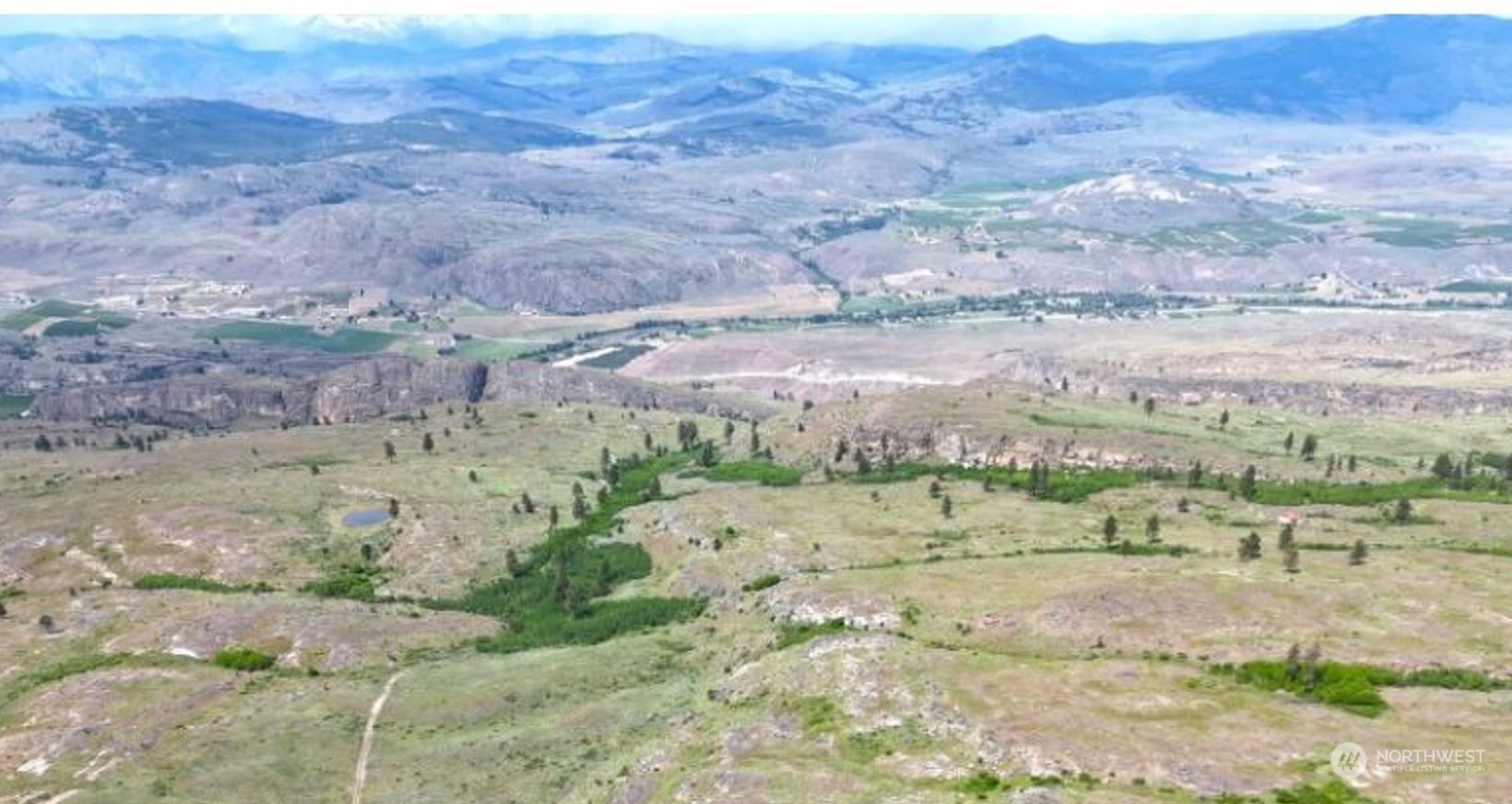 0 McLaughlin Canyon Road, Unit YCC Tonasket, WA 98855 - Photo 4 of 9 a view of a dry yard with trees