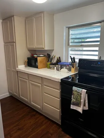 a kitchen with a sink and cabinets