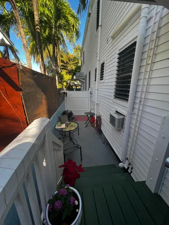 a view of balcony with a potted plant