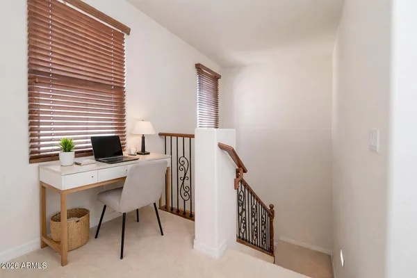 a view of a workspace with furniture