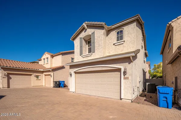 an aerial view of residential building with parking