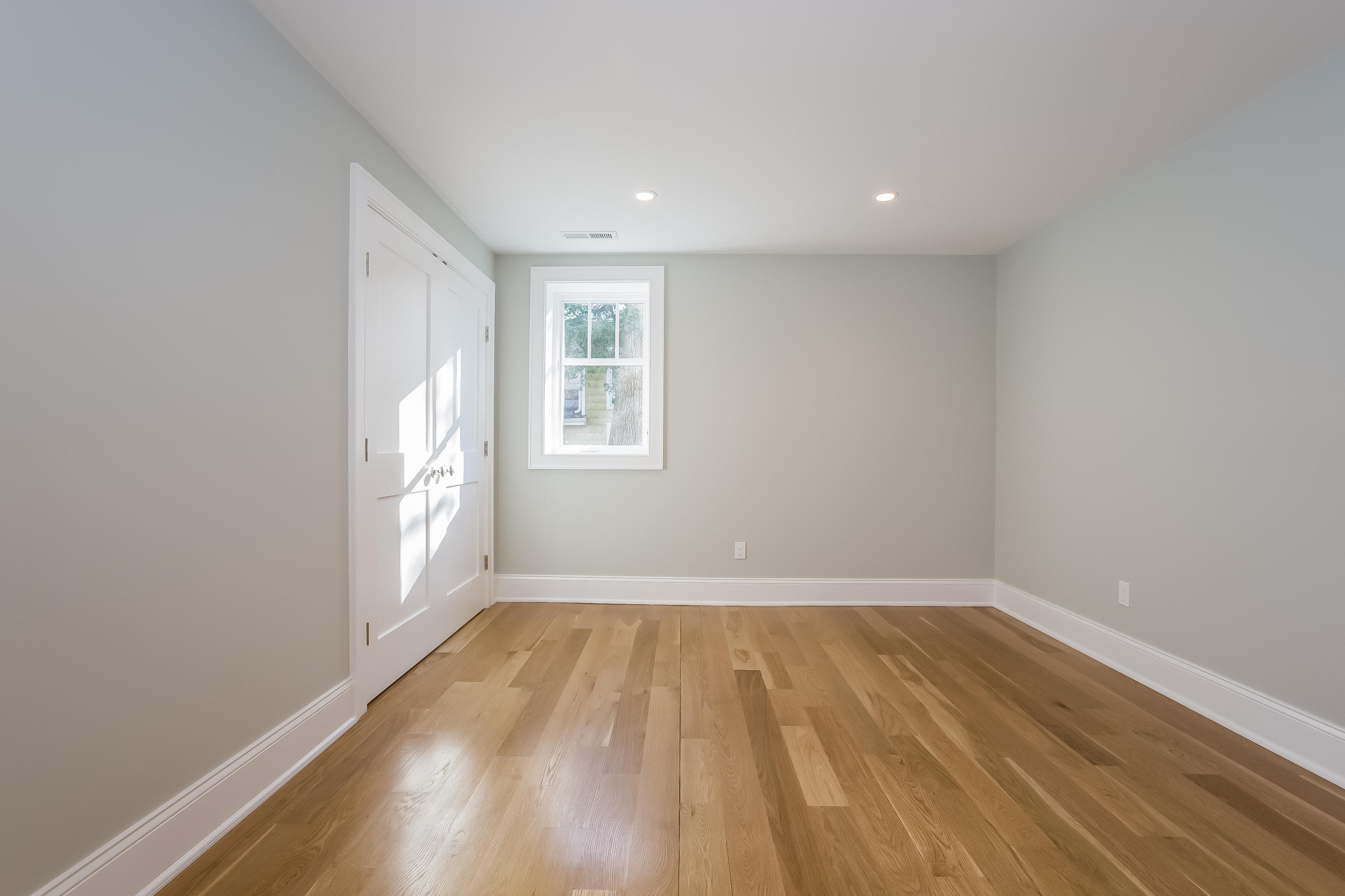26 Range Road Rowayton, CT 06853 - Photo 22 of 26 wooden floor in an empty room with a window