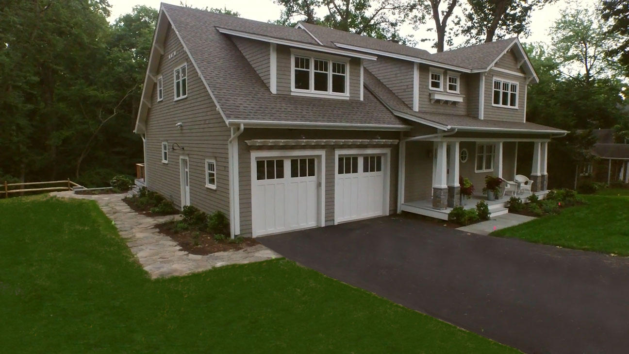 26 Range Road Rowayton, CT 06853 - Photo 23 of 26 a front view of a house with a garden and trees