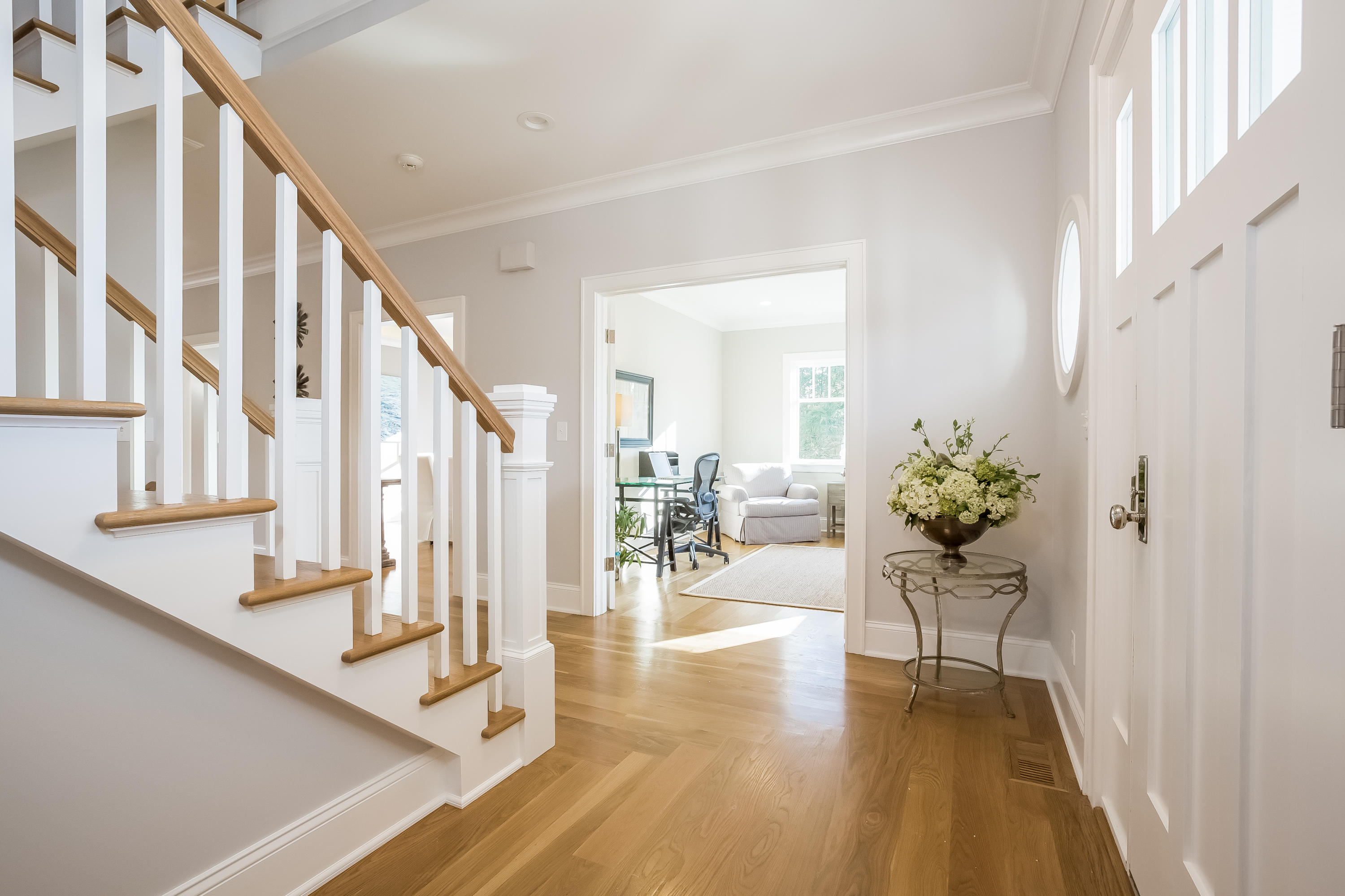 26 Range Road Rowayton, CT 06853 - Photo 4 of 26 a view of an entryway with wooden floor and a potted plant