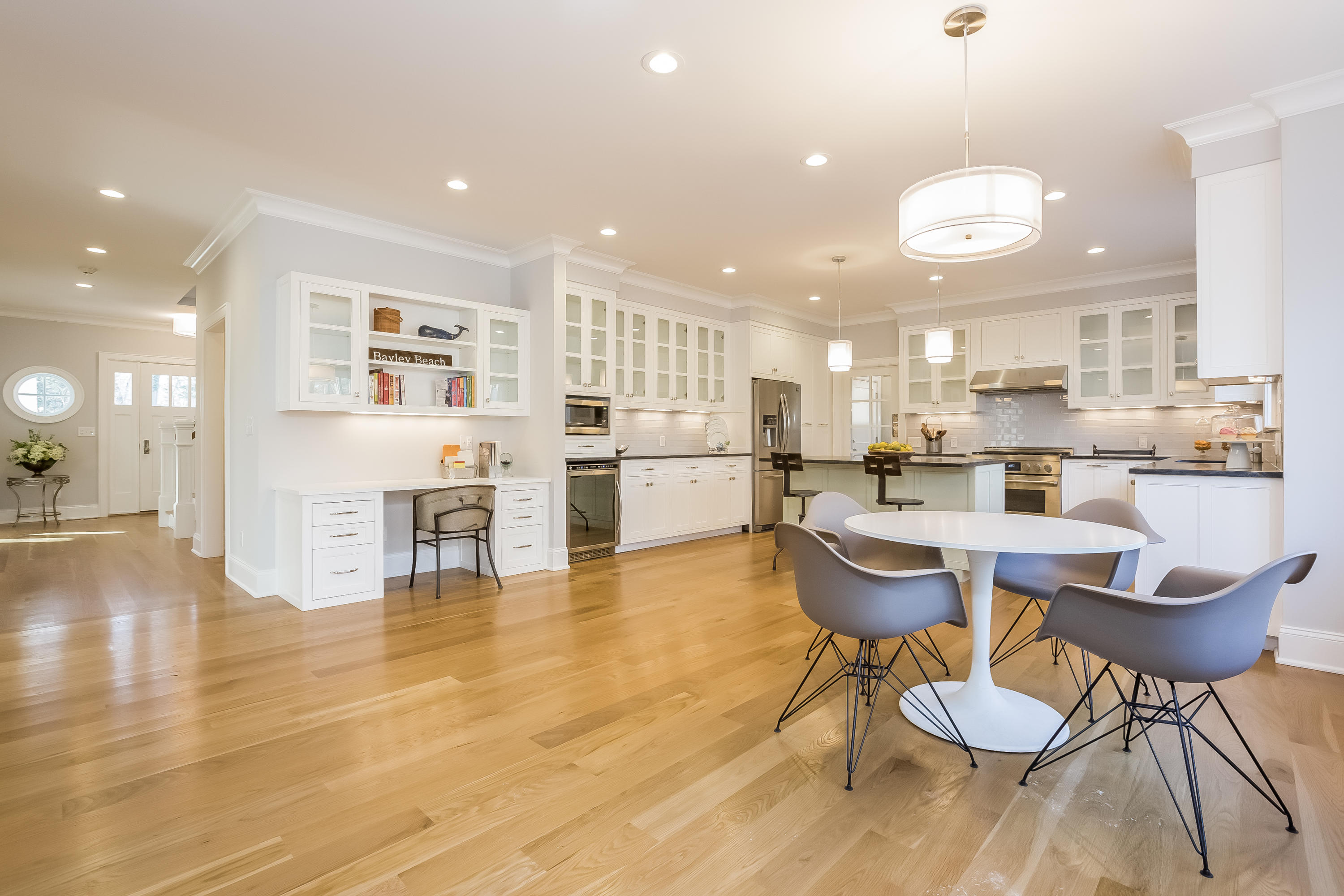 26 Range Road Rowayton, CT 06853 - Photo 7 of 26 a kitchen with a dining table chairs stainless steel appliances and cabinets