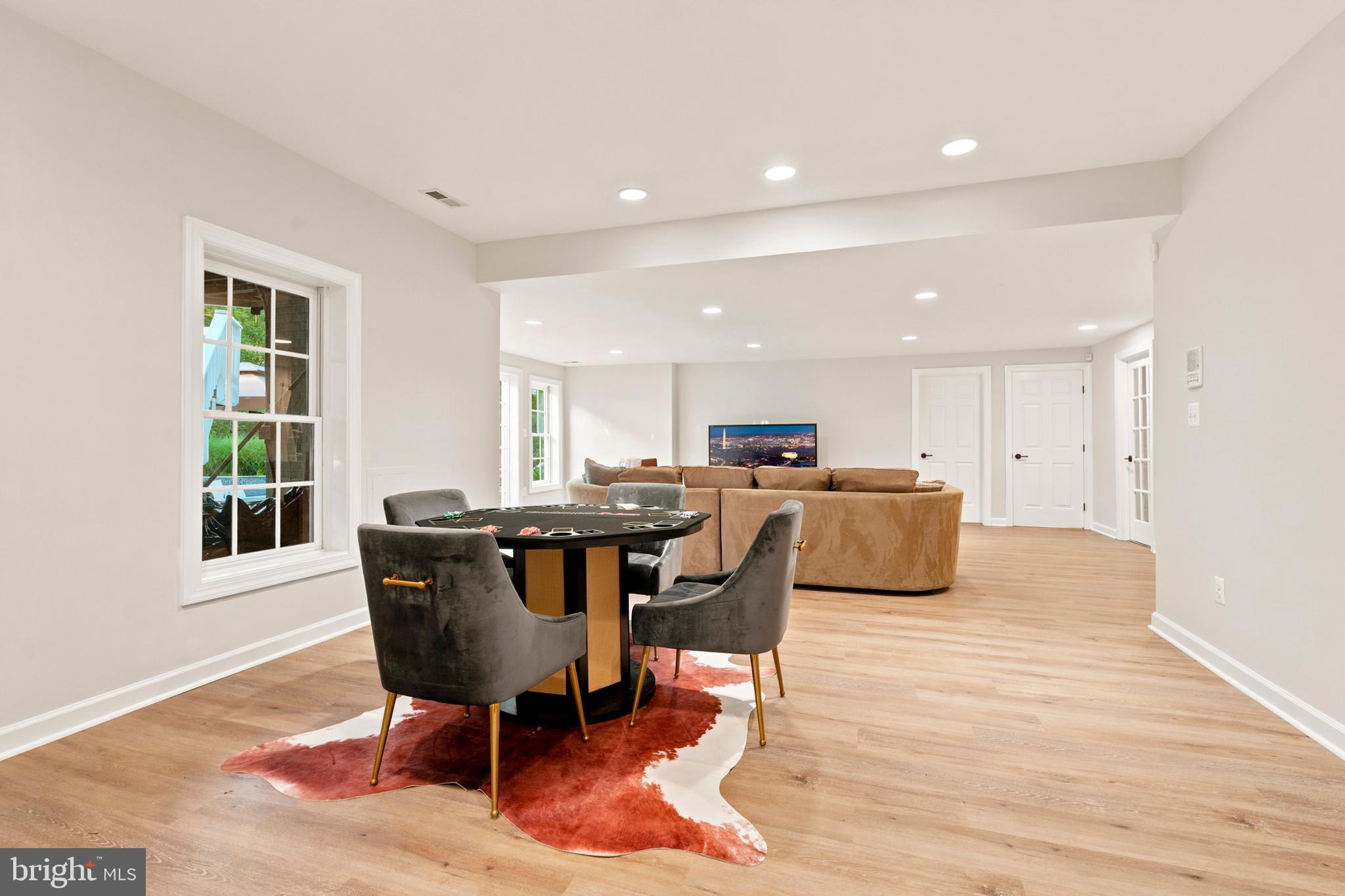 9313 Harrisons Farm Way Laytonsville, MD 20882 - Photo 52 of 77 a view of a dining room with furniture and a table