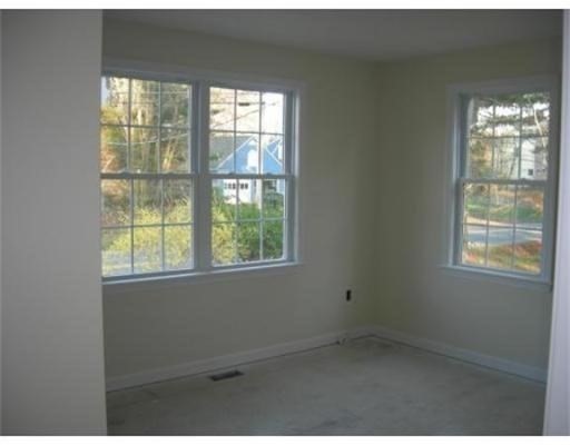 154 Prospect Street, Unit 154 Acton, MA 01720 - Photo 4 of 10 a room that has a window