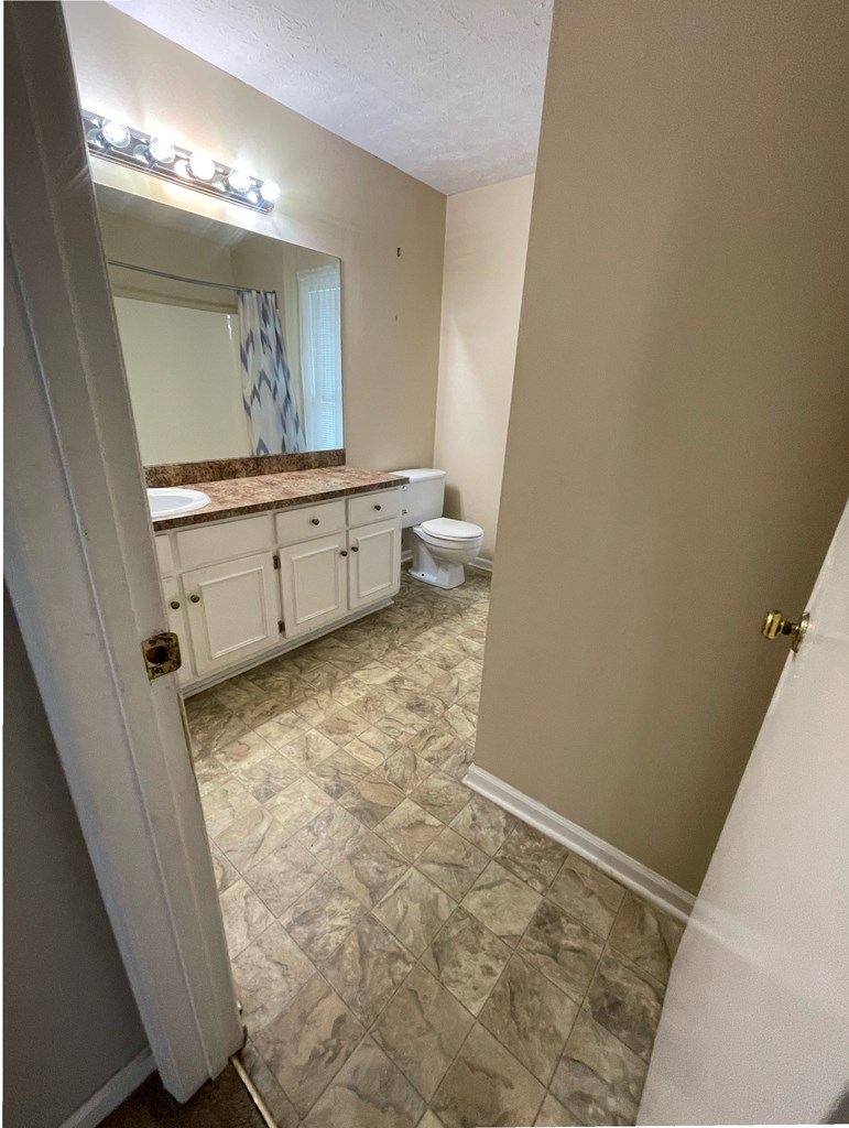 1613 Layard Drive Columbus, GA 31907 - Photo 4 of 5 a bathroom with a sink and a mirror