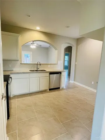 a view of a kitchen with a sink and a dishwasher