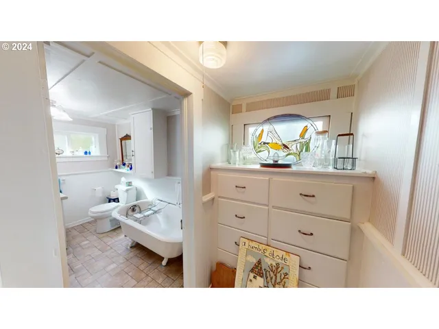 a bathroom with a sink vanity and mirror