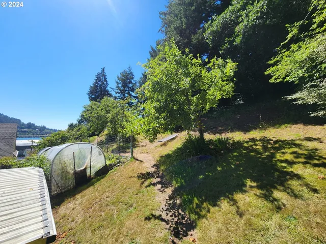 a view of a backyard with sitting area