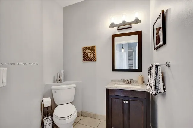 a living room with furniture fireplace and a table