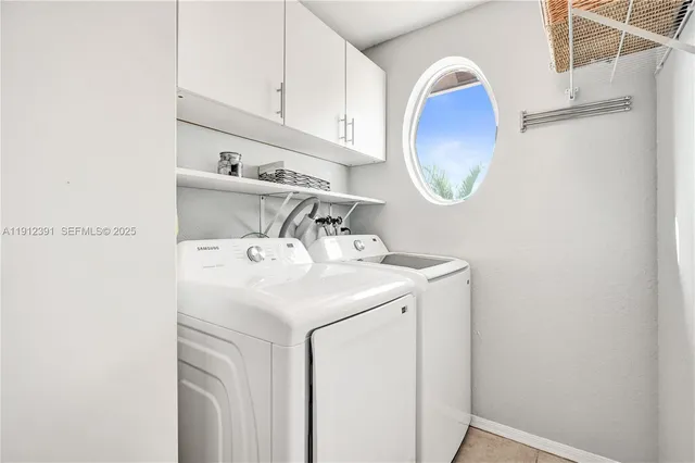 a view of a room with wooden floor and glass door