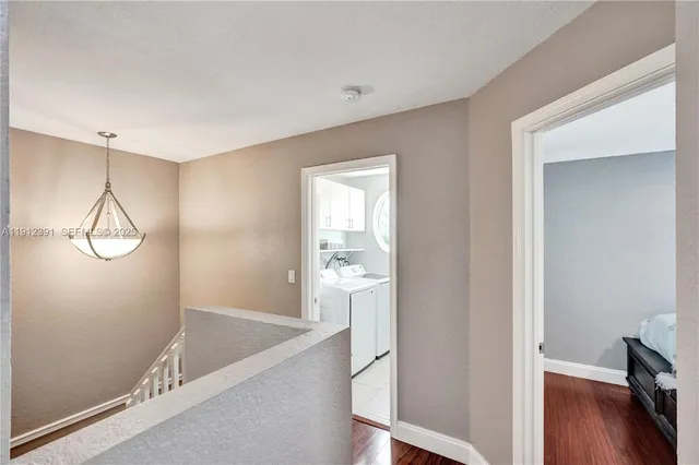 a patio with glass top table and chairs